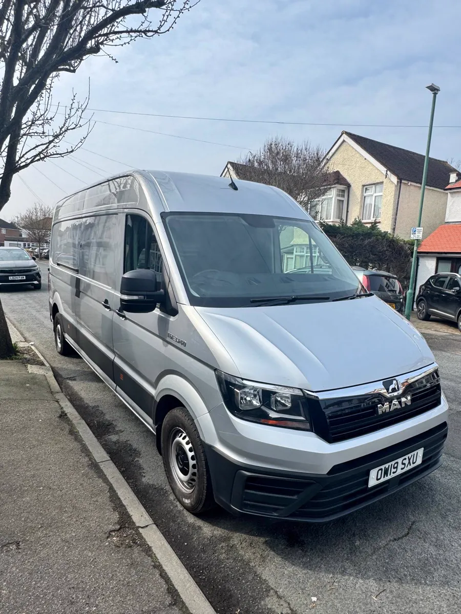 MEN & VAN LTD's silver extra-long wheelbase MAN TGE van parked on a London street